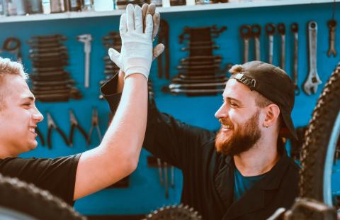 two men in a bike shop