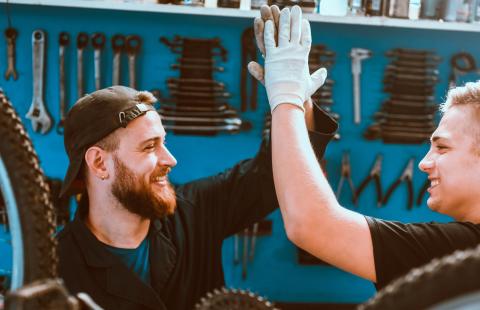 two men in a bike shop