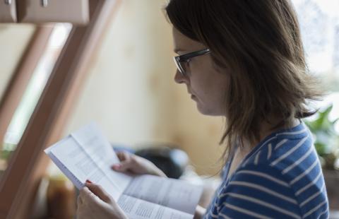 woman reading papers